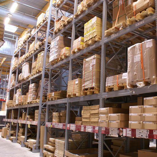 A warehouse with boxes on shelves